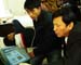 Beijing University cardiology chief Prof Huo and Dr Zhang examine patient